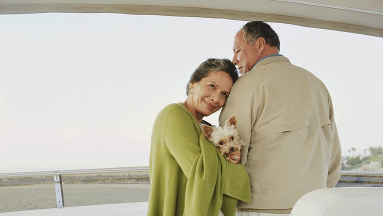 A woman holding the arm of her male partner