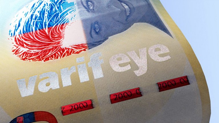 Iridescent color effects on a banknote with the inscription "varifeye".