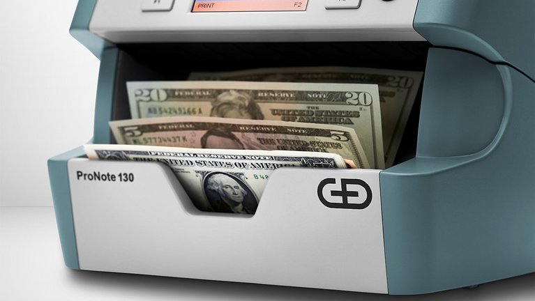 Close-up of the output tray of the ProNote® 130 tabletop banknote processing system