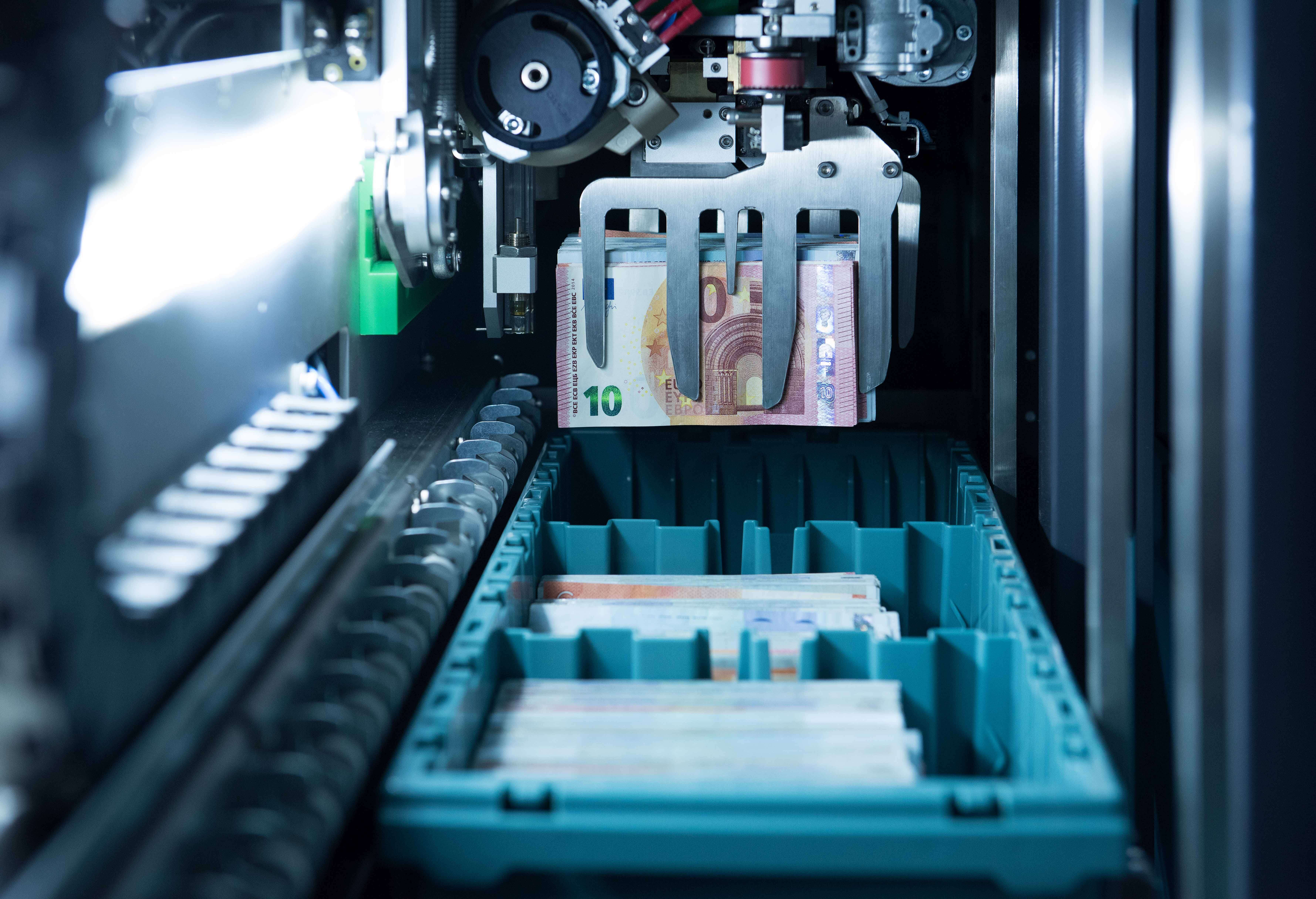 Photo from inside a machine that automatically processes banknotes