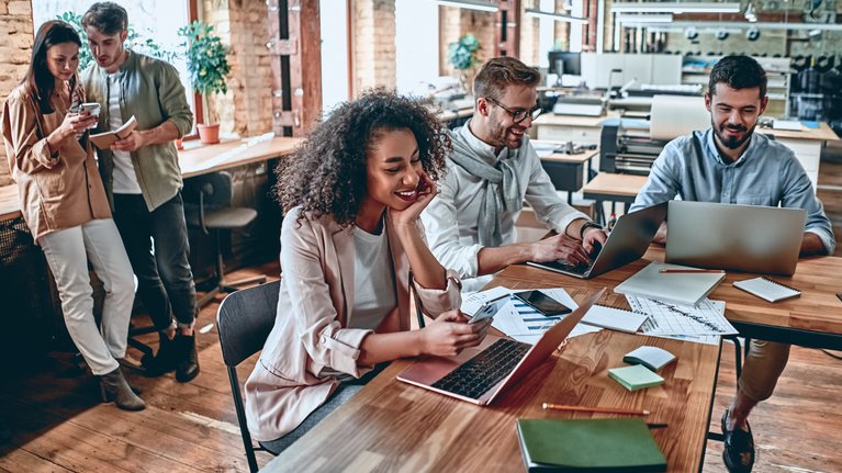 People working together using eSIM Device Enablement Service