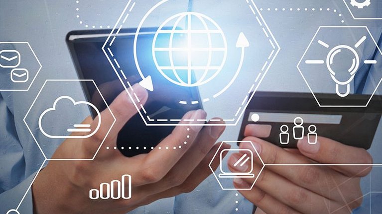 Person taps on smartphone and holds a credit card in one hand