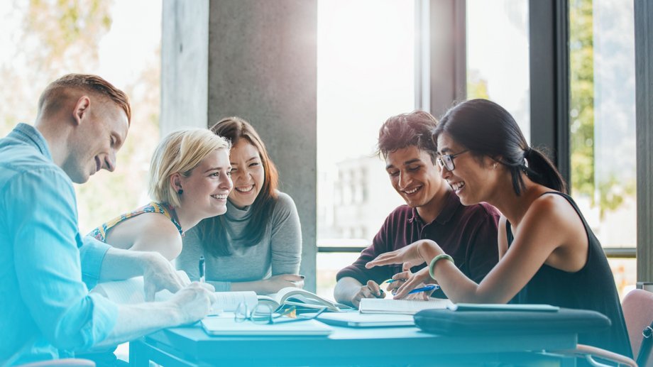 a group of happy people sitting together and discussing
