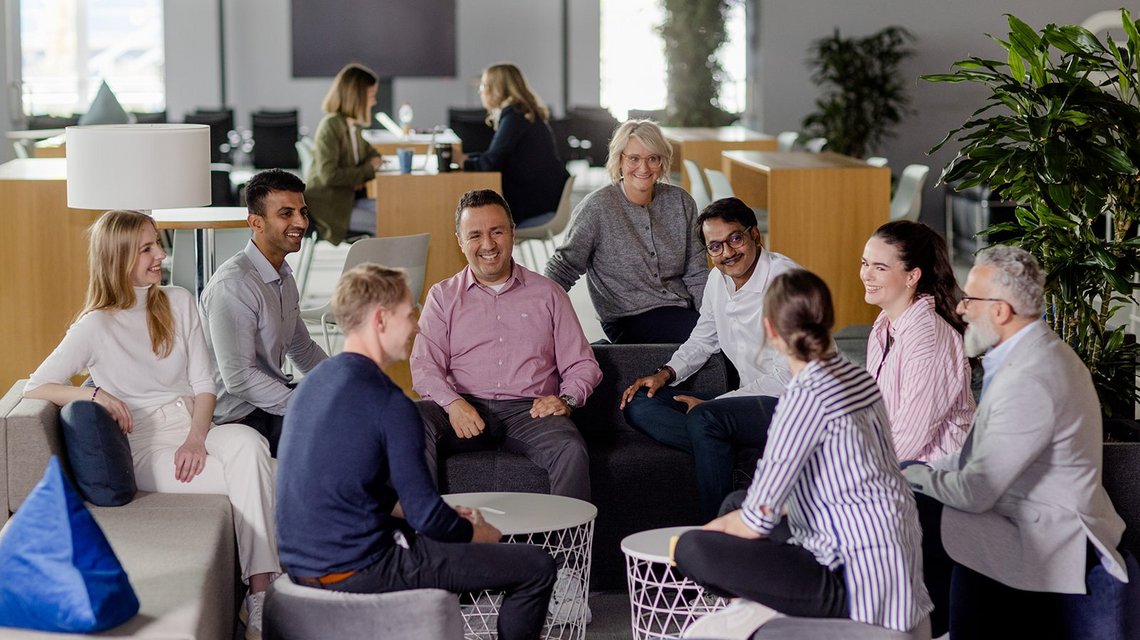 Team discussion in a relaxed office environment