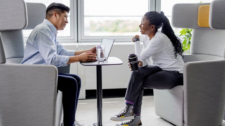 Two colleagues in a meeting at the office