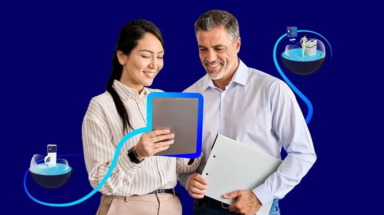 Two professionals interacting with digital devices