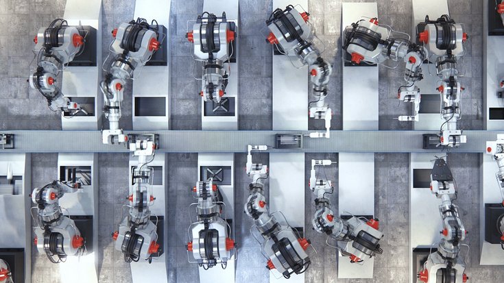 Several robotic arms and working at an assembly line