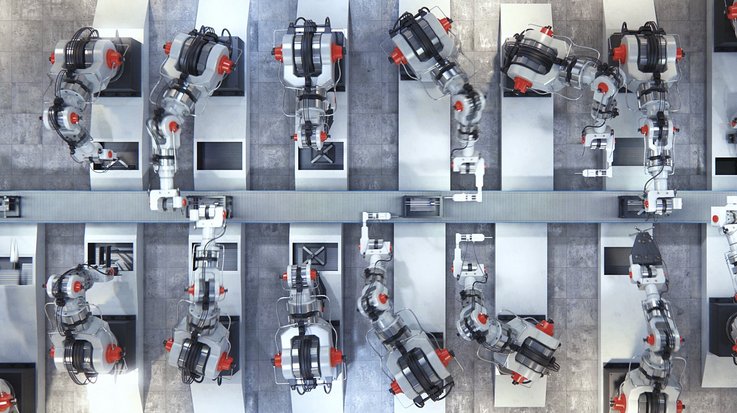 Several robotic arms and working at an assembly line