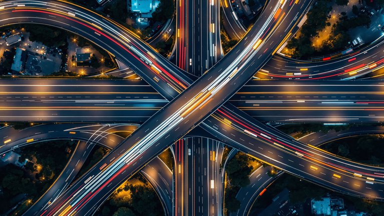 Aerial view of a massive highway interchange at night