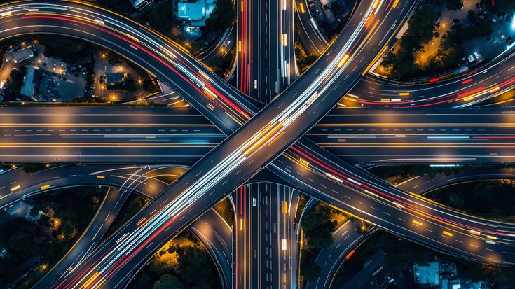 Aerial view of a massive highway interchange at night