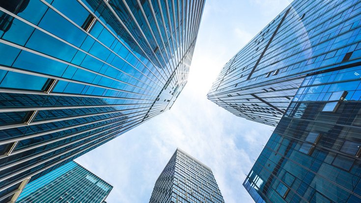 Low-angle view of blue glass skyscrapers
