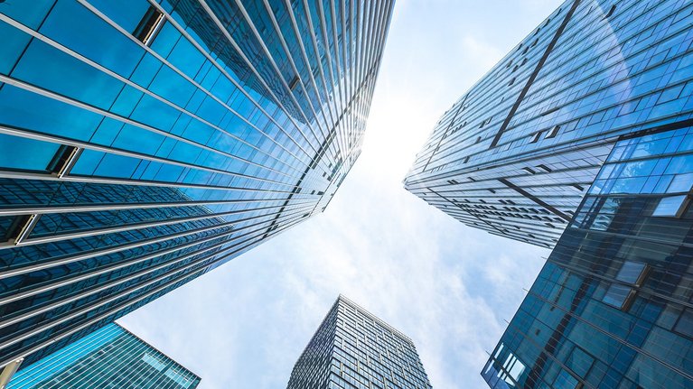 Low-angle view of blue glass skyscrapers