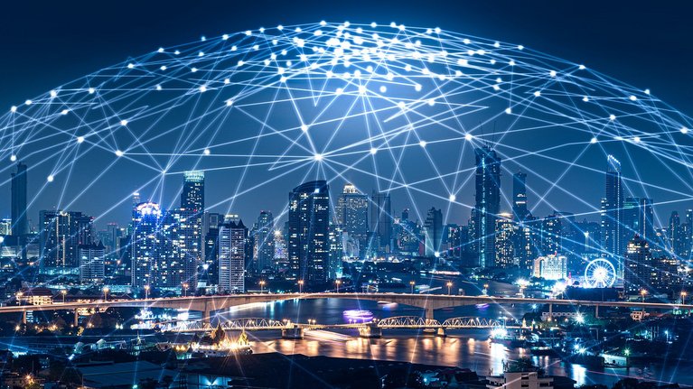 Cityscape under a large, glowing spherical network