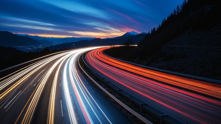 Long exposure of car light trails on a highway at dusk