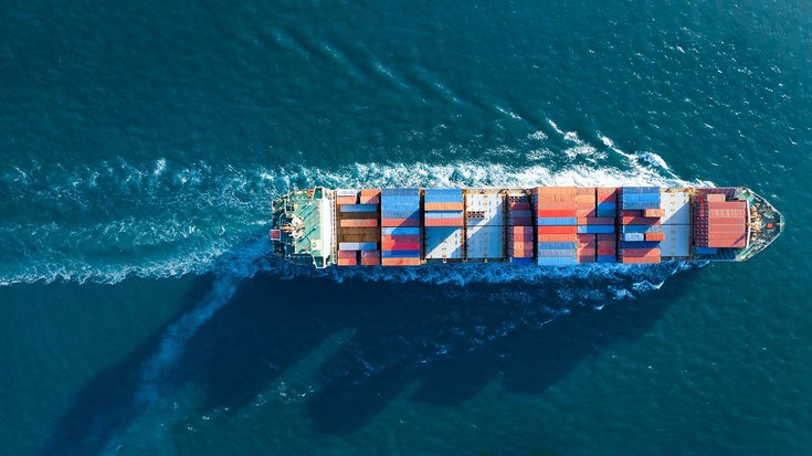 Aerial view of a large cargo container ship at sea