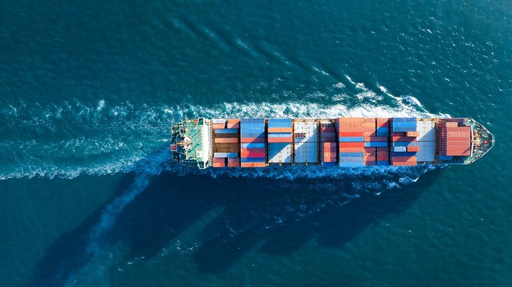 Aerial view of a large cargo container ship at sea
