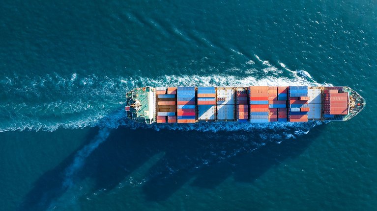 Aerial view of a large cargo container ship at sea