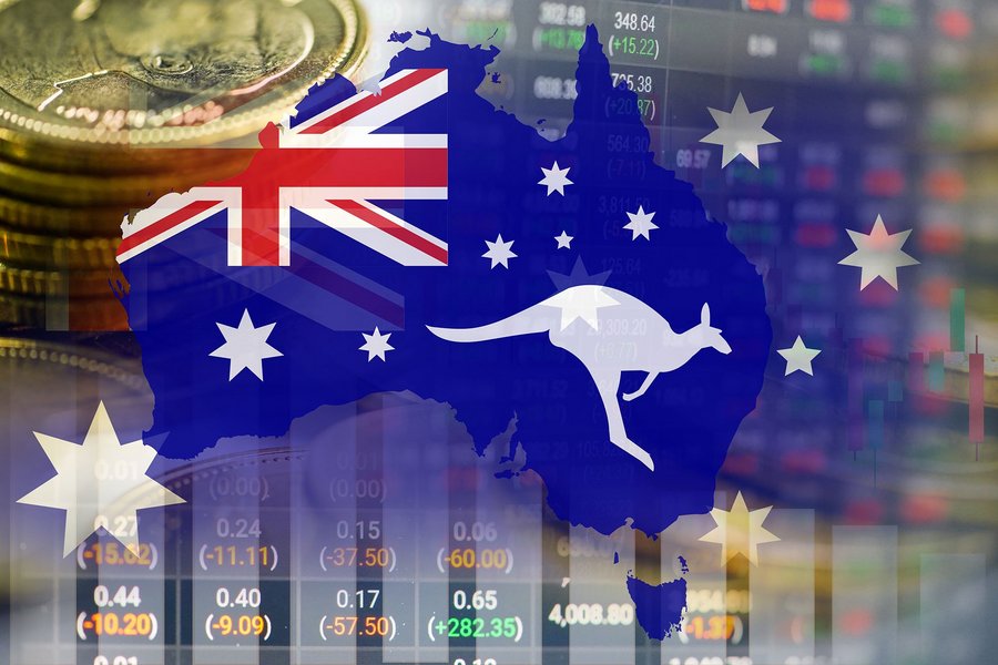 Outline of Australia with its flag, coins, and stock market data in the background.