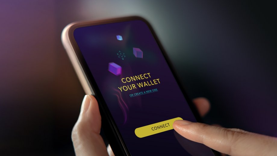 Person is holding a smartphone, ready to tap "Connect" button in a crypto wallet app.