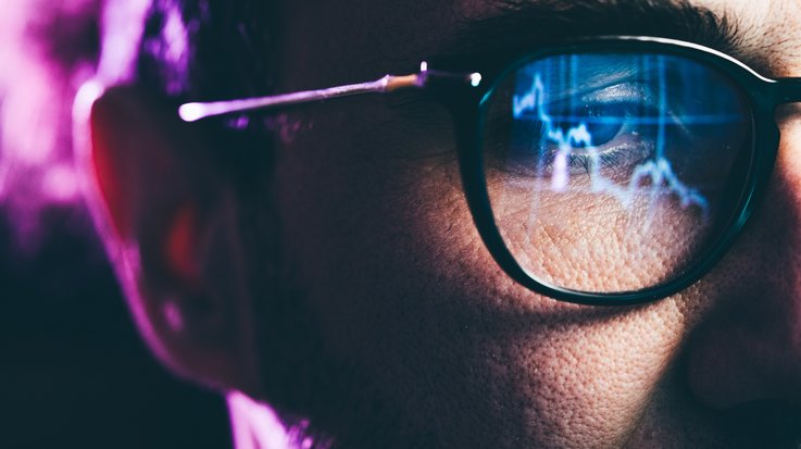 Man with glasses in digital area