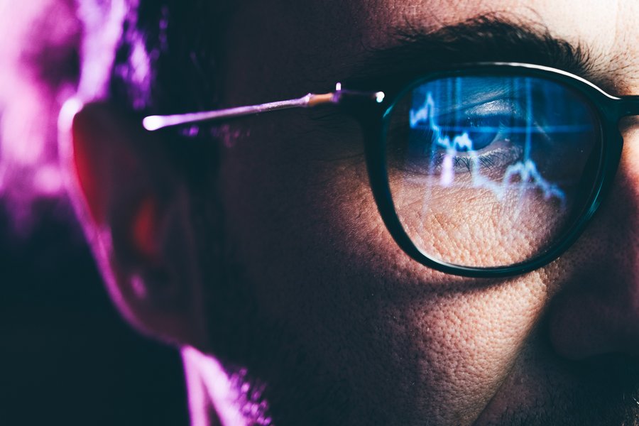 Man with glasses in digital area