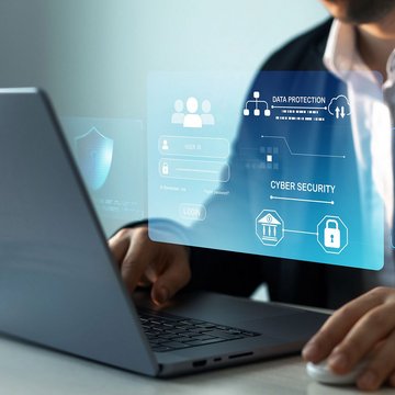Man using a laptop to securely log into his account, highlighting safe online access and security.