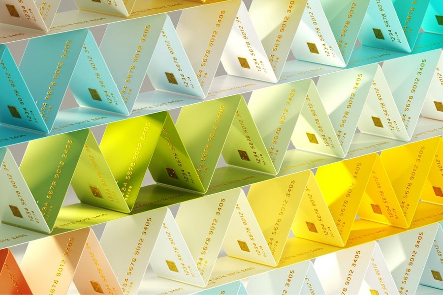 Multicolored credit cards organized into triangular pattern representing personalized card issuance