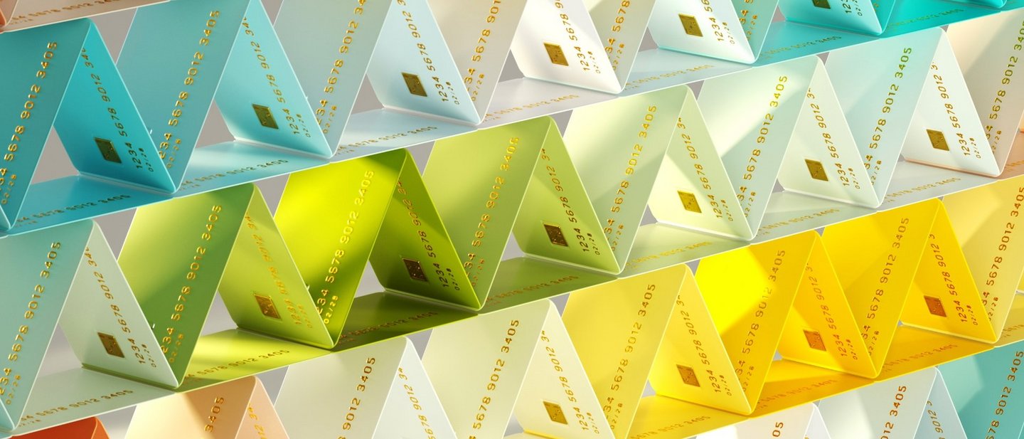 Multicolored credit cards organized into triangular pattern representing personalized card issuance