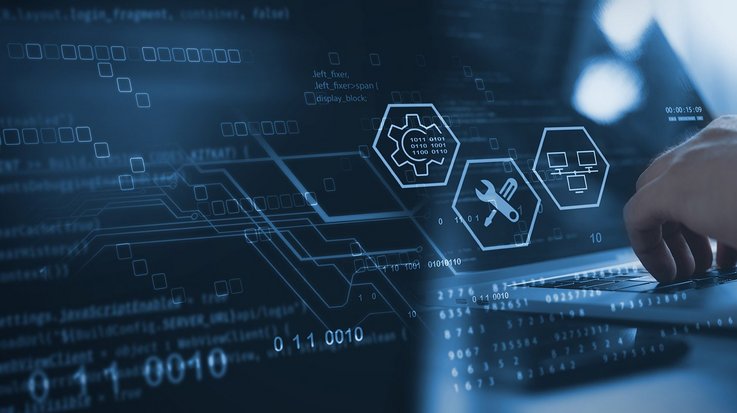 Technician works on laptop to manage database, big data and digital technologies.