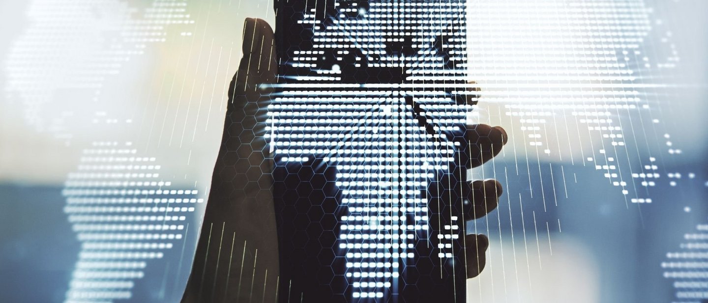 Hand holding a smartphone with a digital world map showing Africa in the center
