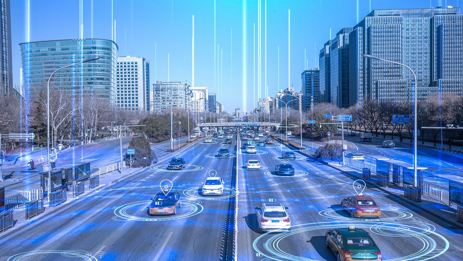 City street with connected cars showing digital network lines representing smart mobility