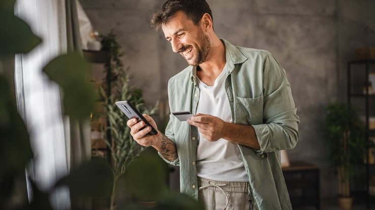 A man checks his credit card date.