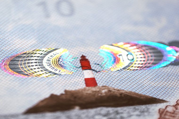 Banknote with a security element as part of its design