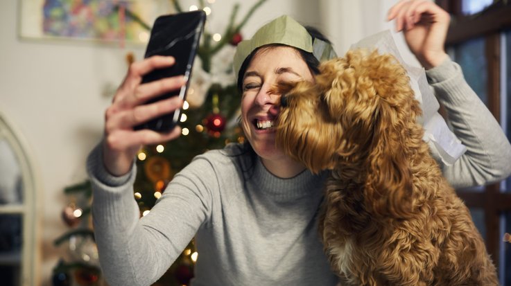 A woman takes a selfie with her dog
