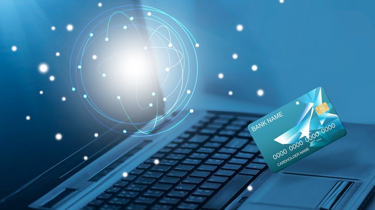 Technology concept bank card and a laptop