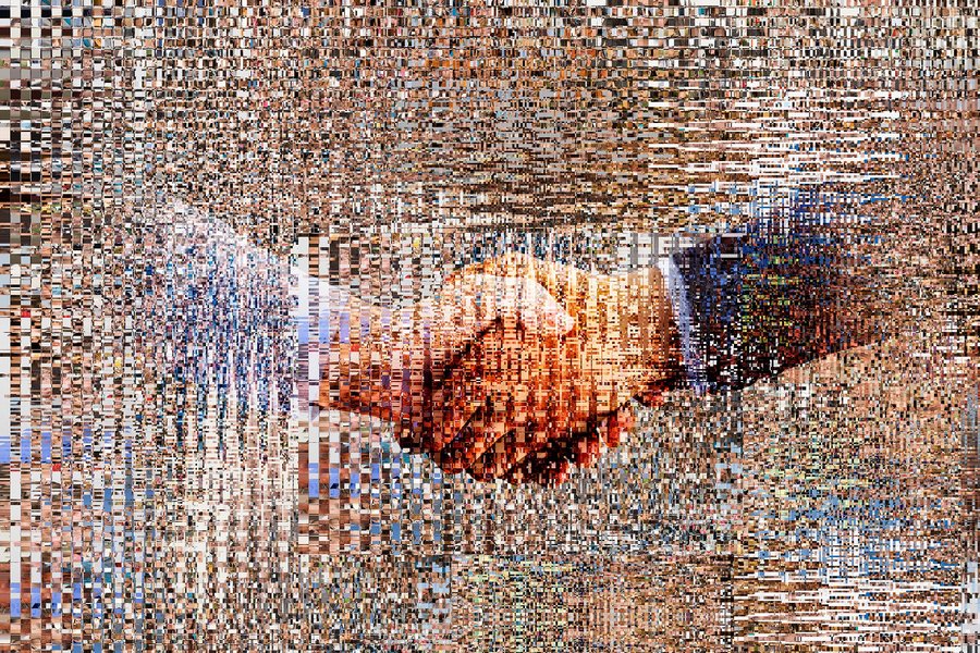 Pixelated hands of businessmen shaking hands