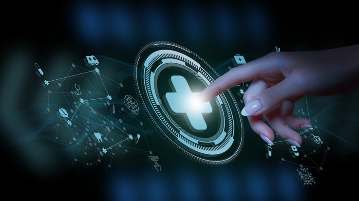 A doctor is working on a computer