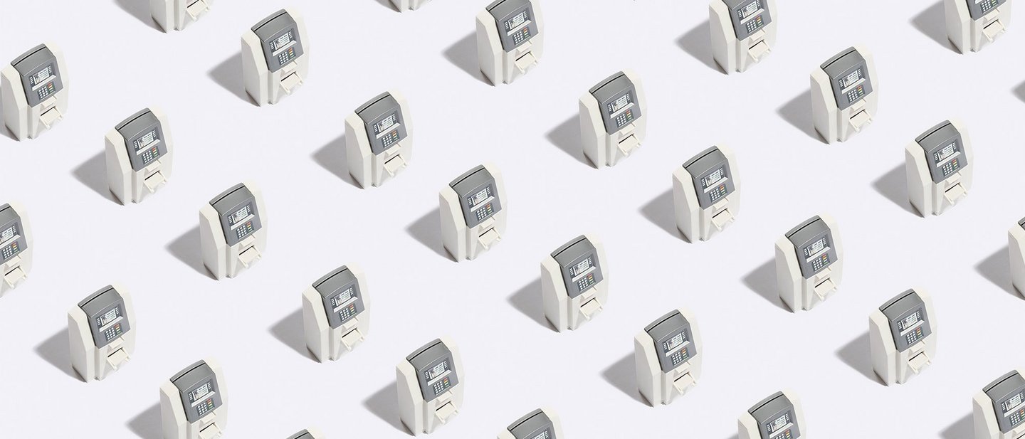 Row of many kiosks showing the wide reach of banks that utilize instant issuance for cards