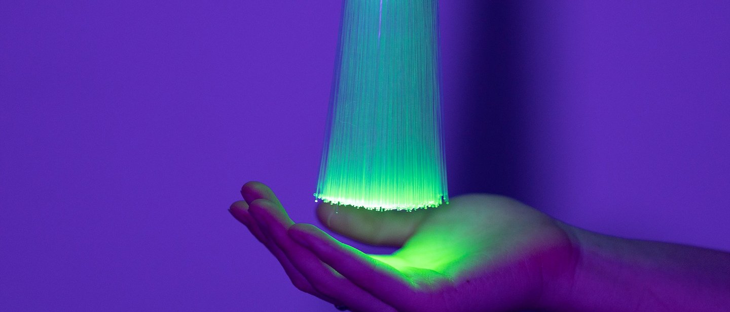 Artificial Intelligence concept a woman’s hand holding bundle of light