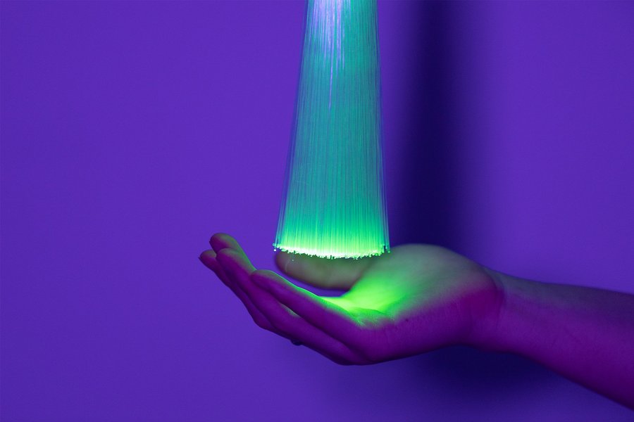 Artificial Intelligence concept a woman’s hand holding bundle of light