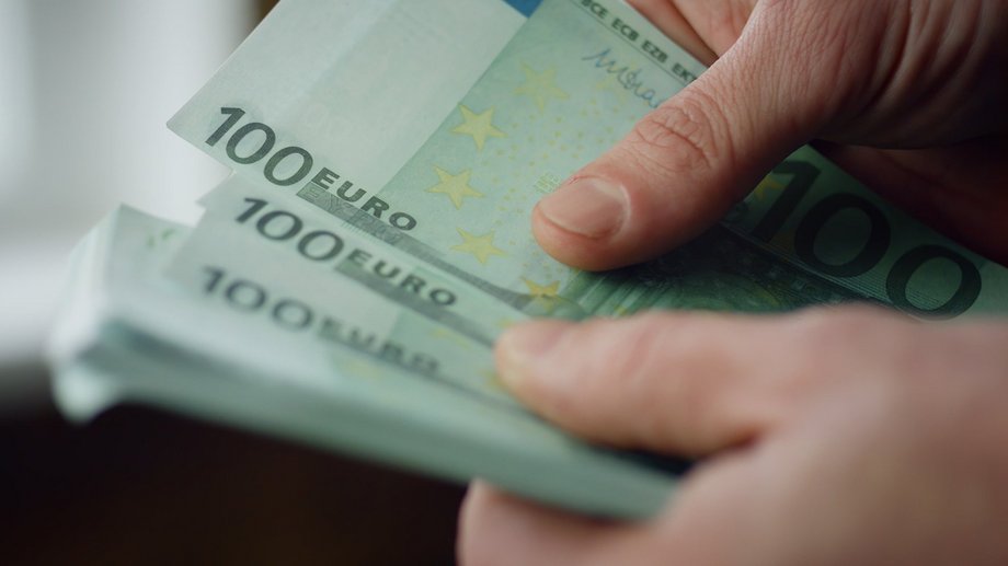 A person counting cash