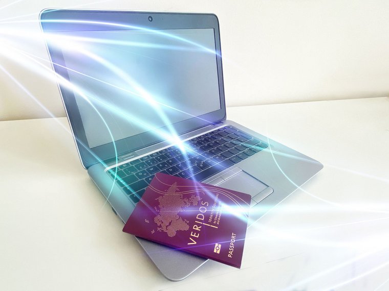 A laptop with a passport and light tracks symbolizes eGovernment and measures in a crisis