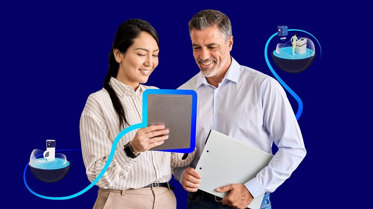 A man and a woman looking at a tablet screen