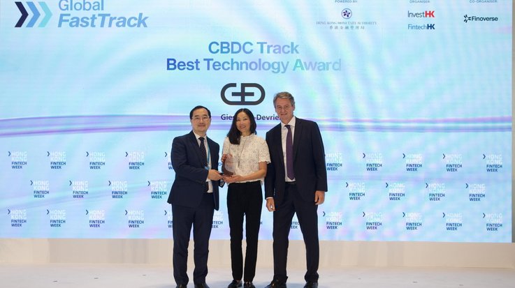 Colin Pou, Executive Director of the HKMA, Polly Bäumler, Business Developer at G+D's CBDC unit and Alexander Seelaender, Head of G+D Hub Asia, Managing Director