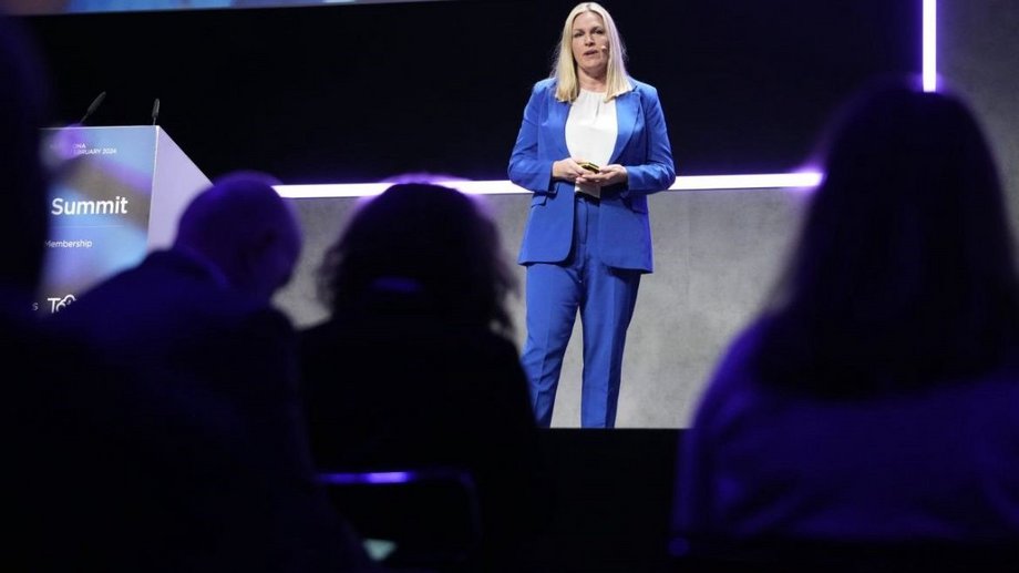 female person talking on stage in front of crowd at MWC24 summit Barcelona