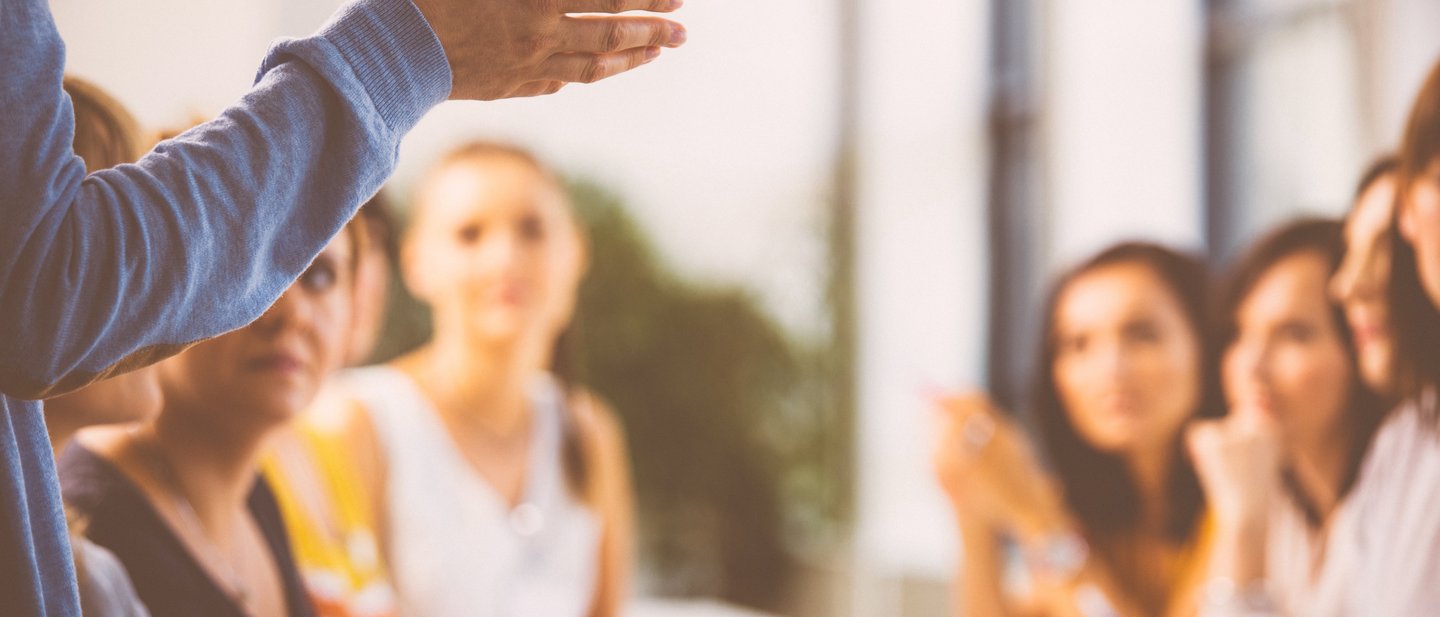 Group of smiling women at a leadership training.