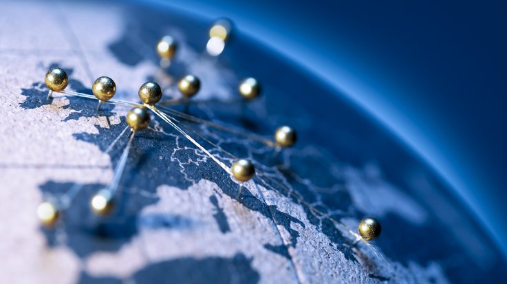 World map with golden pins connected to each other