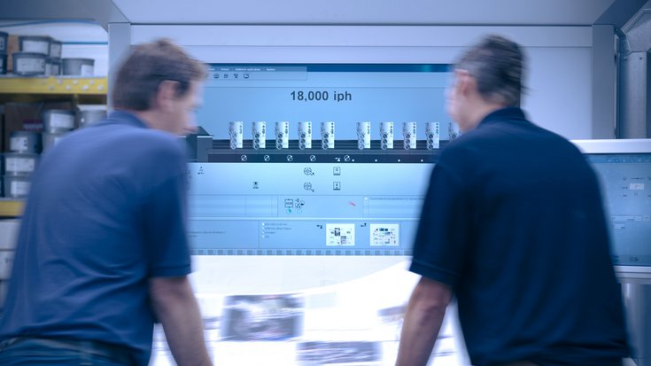 Two persons standing in front of a printwork