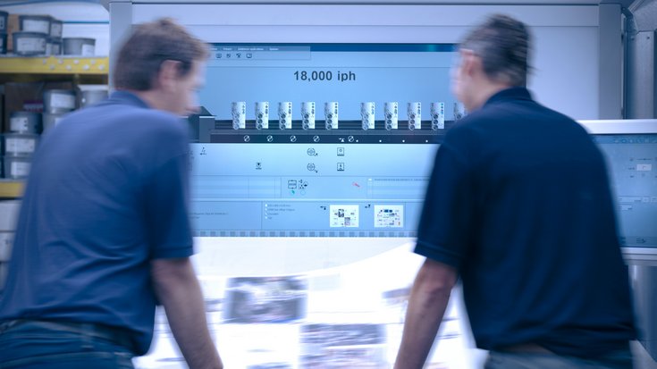 Two persons standing in front of a printwork