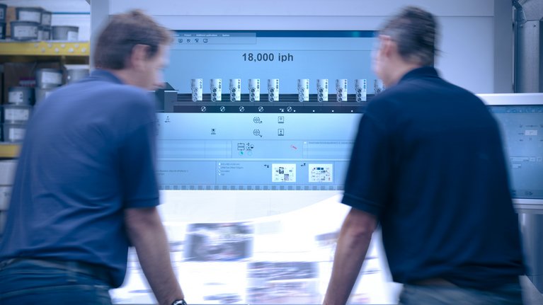 Two persons standing in front of a printwork